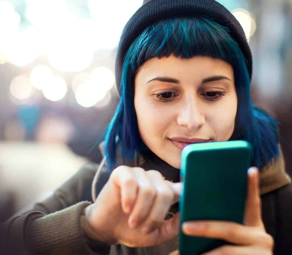 Woman scrolling through her phone