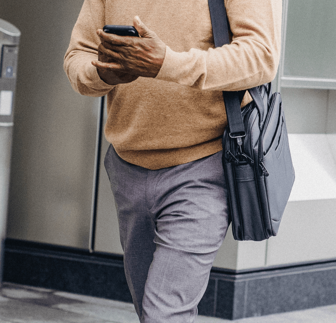 Business man walking with phone